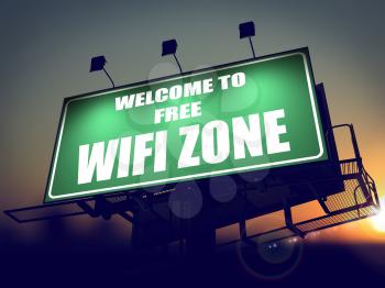 Welcome to Free WiFi  Zone - Green Billboard on the Rising Sun Background.