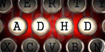 ADHD on Old Typewriter's Keys on Red Background.