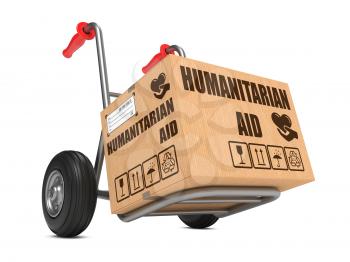 Humanitarian Aid Slogan on Cardboard Box on Hand Truck White Background.