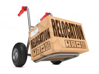 Cardboard Box with Warehouse Relocation on Hand Truck White Background.