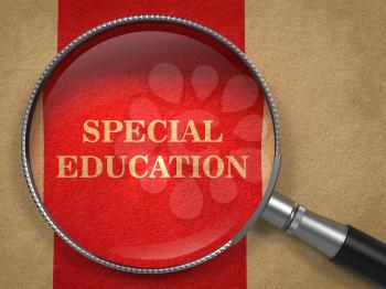 Special Education concept. Magnifying Glass on Old Paper with Red Vertical Line Background.