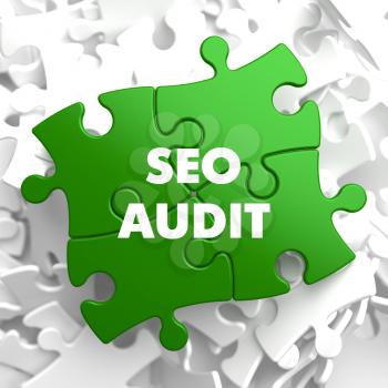 SEO Audit on Green Puzzle on White Background.