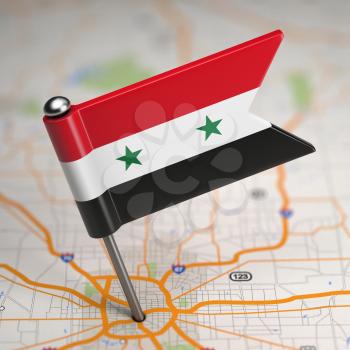 Small Flag of Syrian Arab Republic on a Map Background with Selective Focus.