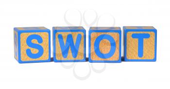 SWOT on Colored Wooden Childrens Alphabet Block Isolated on White.