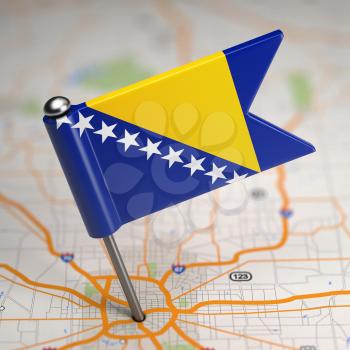 Small Flag Bosnia and Herzegovina on a Map Background with Selective Focus.