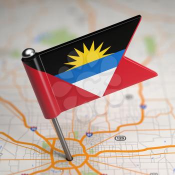 Small Flag of Antigua and Barbuda on a Map Background with Selective Focus.