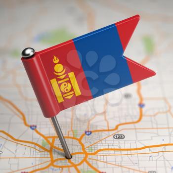 Small Flag of Mongolia on a Map Background with Selective Focus.