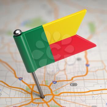 Small Flag Republic of Benin on a Map Background with Selective Focus.