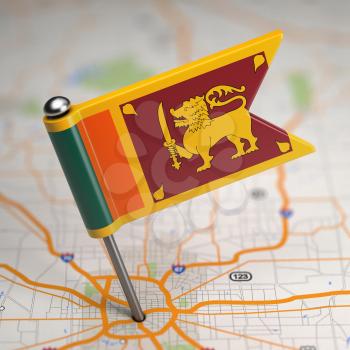 Small Flag of Sri Lanka on a Map Background with Selective Focus.