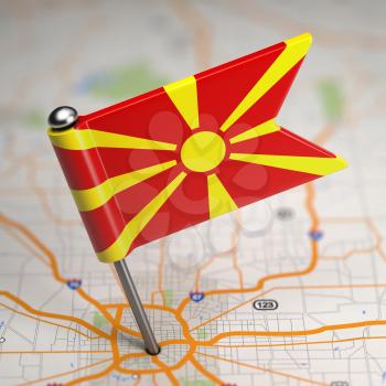 Small Flag Republic of Macedonia on a Map Background with Selective Focus.