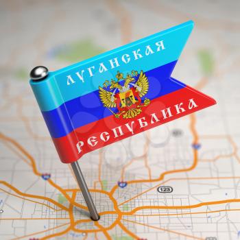 Small Flag of Luhansk People's Republic- Sticked in the Map Background with Selective Focus.
