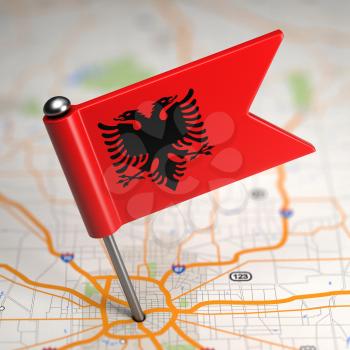 Small Flag of Republic of Albania Sticked in the Map Background with Selective Focus.