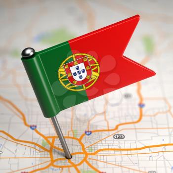 Small Flag of Portugal Sticked in the Map Background with Selective Focus.