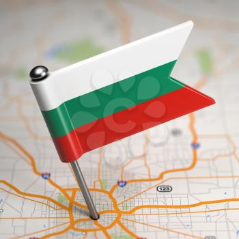 Small Flag of Bulgaria Sticked in the Map Background with Selective Focus.