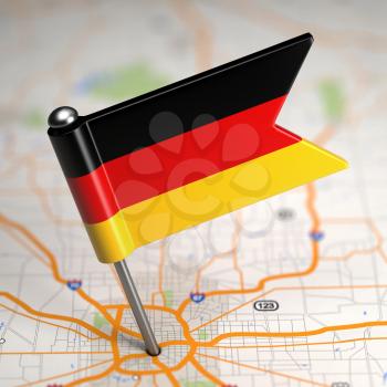 Small Flag of Federal Republic of Germany on a Map Background with Selective Focus.