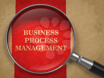 Business Process Management Concept. Magnifying Glass on Old Paper with Red Vertical Line Background.