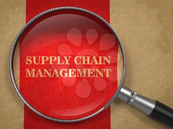 Supply Chain Management Concept. Text on Old Paper with Red Vertical Line Background through Magnifying Glass.