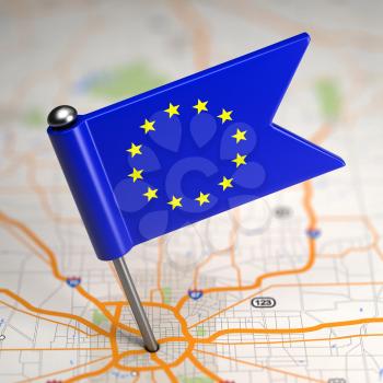 Small Flag of European Union on a Map Background with Selective Focus.