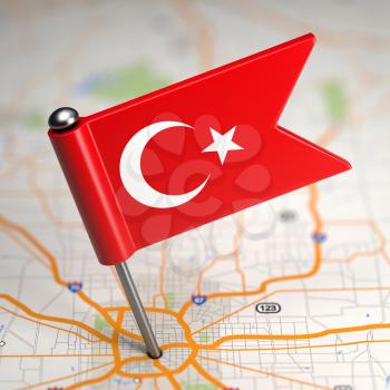 Small Flag of Turkey on a Map Background with Selective Focus.