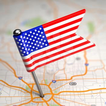 Small Flag of United States of America on a Map Background with Selective Focus.