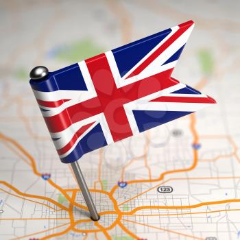 Small Flag of United Kingdom of Great Britain on a Map Background with Selective Focus.