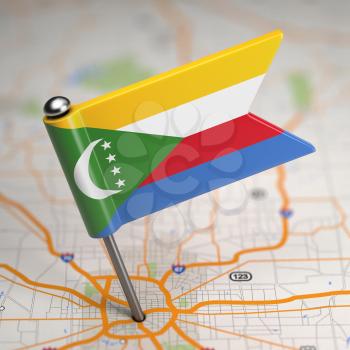Small Flag of Comoros on a Map Background with Selective Focus.