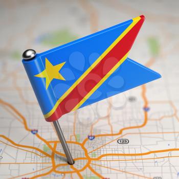 Small Flag Democratic Republic of the Congo on a Map Background with Selective Focus.