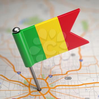 Small Flag of Mali on a Map Background with Selective Focus.