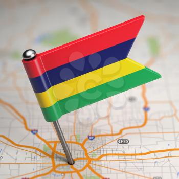 Small Flag of Mauritius on a Map Background with Selective Focus.