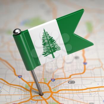 Small Flag of Norfolk Island on a Map Background with Selective Focus.