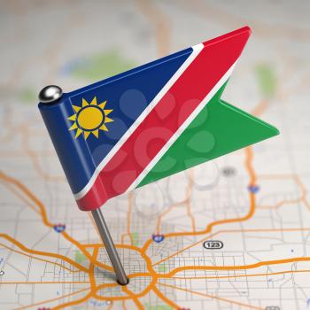 Small Flag of Namibia on a Map Background with Selective Focus.
