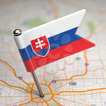 Small Flag of Slovakia on a Map Background with Selective Focus.
