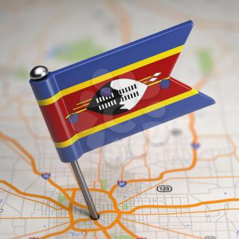 Small Flag of Swaziland on a Map Background with Selective Focus.