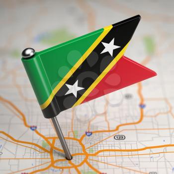 Small Flag of Saint Kitts and Nevis on a Map Background with Selective Focus.