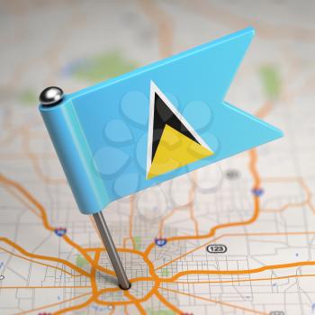 Small Flag of Saint Lucia on a Map Background with Selective Focus.