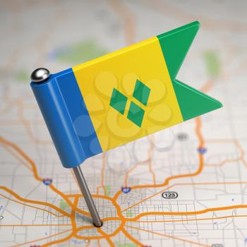 Small Flag Saint Vincent and the Grenadines on a Map Background with Selective Focus.