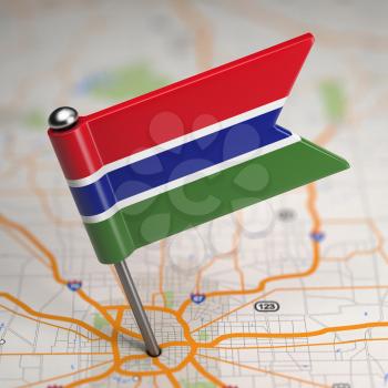 Small Flag of Gambia on a Map Background with Selective Focus.