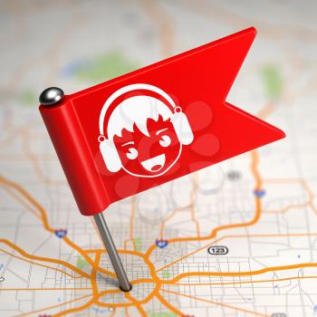 Red Small Flag with Boy with Headphones on a Map Background with Selective Focus.