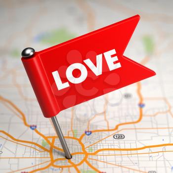 Love - Red Small Flag on a Map Background with Selective Focus.