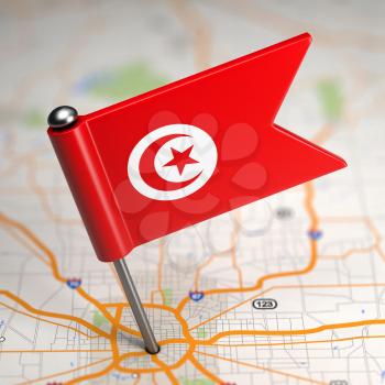 Small Flag of Tunisia on a Map Background with Selective Focus.