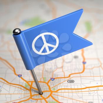 Small Flag of Pacifism on a Map Background with Selective Focus.