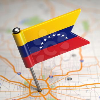Small Flag of Venezuela on a Map Background with Selective Focus.