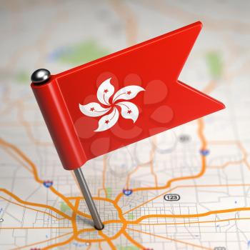Small Flag of Hong Kong on a Map Background with Selective Focus.