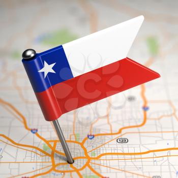 Small Flag of Chile on a Map Background with Selective Focus.