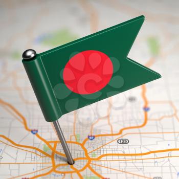 Small Flag of Bangladesh on a Map Background with Selective Focus.