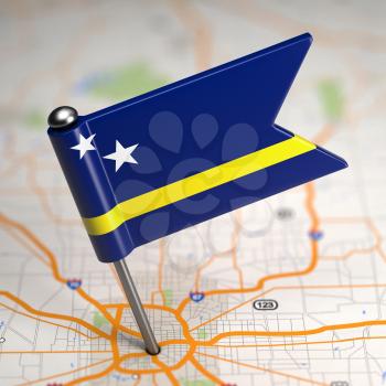 Small Flag of Curacao on a Map Background with Selective Focus.