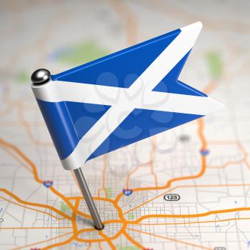 Small Flag of Scotland on a Map Background with Selective Focus.