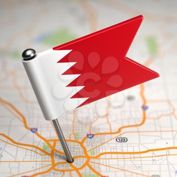 Small Flag of Bahrain on a Map Background with Selective Focus.