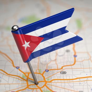 Small Flag Republic of Cuba on a Map Background with Selective Focus.