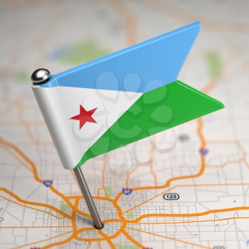 Small Flag Republic of Djibouti on a Map Background with Selective Focus.